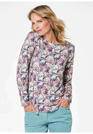 Chemise à manches longues avec un motif floral abstrait multicolore sur fond clair, fabriquée en tissu doux avec une coupe décontractée.
