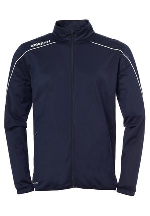 Veste marine en tissu lisse, dotée d'un col montant, d'une fermeture éclair intégrale et de rayures blanches le long des épaules.