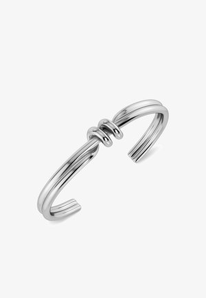 Pulsera de plata minimalista con doble banda y dos lazos redondeados que conectan las bandas en el centro.