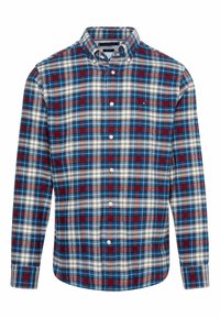 Camicia a quadri nei toni del blu, rosso e bianco. Presenta un colletto button-down, maniche lunghe e una tasca sul petto con una piccola etichetta con logo.