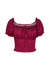 Bordeauxfarbene cropped Bluse mit weißen Punkten, Puffärmeln, gerafftem Tailleneinsatz, Rüschenausschnitt und vorderem Bindedetail.