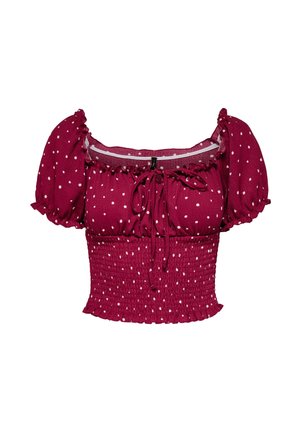 Burgundi värvi lühike pluus valgete täppidega, puhvadega varrukad, hõbedane vöökoht, volangidega kaelus ja ees sidumise detail.