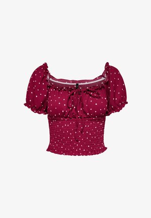 Burgundi värvi lühike pluus valgete täppidega, puhvadega varrukad, hõbedane vöökoht, volangidega kaelus ja ees sidumise detail.