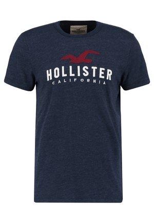 Granatowy T-shirt z krótkim rękawem z czerwonym logo ptaka i białym napisem "Hollister California" na piersi.