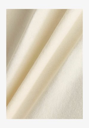 Cotton fabric in cream color with a smooth texture and fine ribbed pattern, displaying gentle folds and drapes.