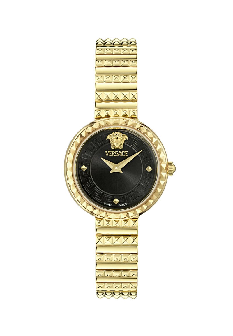 Zelta tonis pulkstenis ar teksturētu siksnu, apaļu melnu ciparnīcu un zelta akcentiem. Aprīkots ar lauva emblēmu un rakstainu rāmīti. Šveicē ražots.