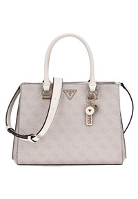 Beige håndtaske med en tekstureret overflade, guldfarvet hardware, dobbelte hanke og en aftagelig rem. Har et nøglering-lignende logo som accent.