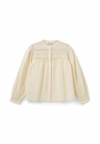 Camicia button-up color crema in cotone, caratterizzata da un collo rotondo, dettagli plissettati e maniche lunghe a sbuffo con polsini con bottoni.