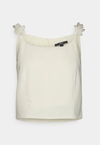 Top cropped branco, sem mangas, feito de um tecido suave. Apresenta dois apliques de flores nas alças e um fecho de zíper nas costas.