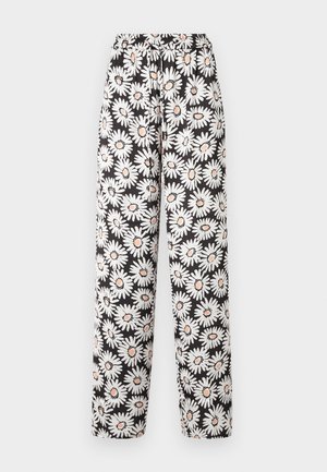 Zwarte broek met een elastische tailleband, versierd met een wit en oranje margrietpatroon. Gemaakt van lichte stof met een zachte textuur.