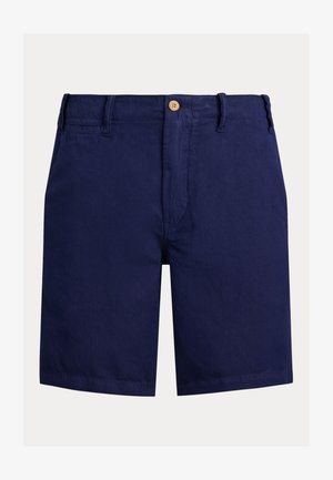 Laivastonsiniset puuvillashortsit, joissa on etumallinen nappikiinnitys, vyölenkit ja sileä pinta. Suora leikkaus polven korkeudella, minimaalisilla yksityiskohdilla.