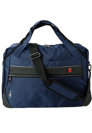 Navy blue travel bag made of durable fabric, featuring a black accent stripe, dual top handles, an adjustable strap, and a front zippered pocket.