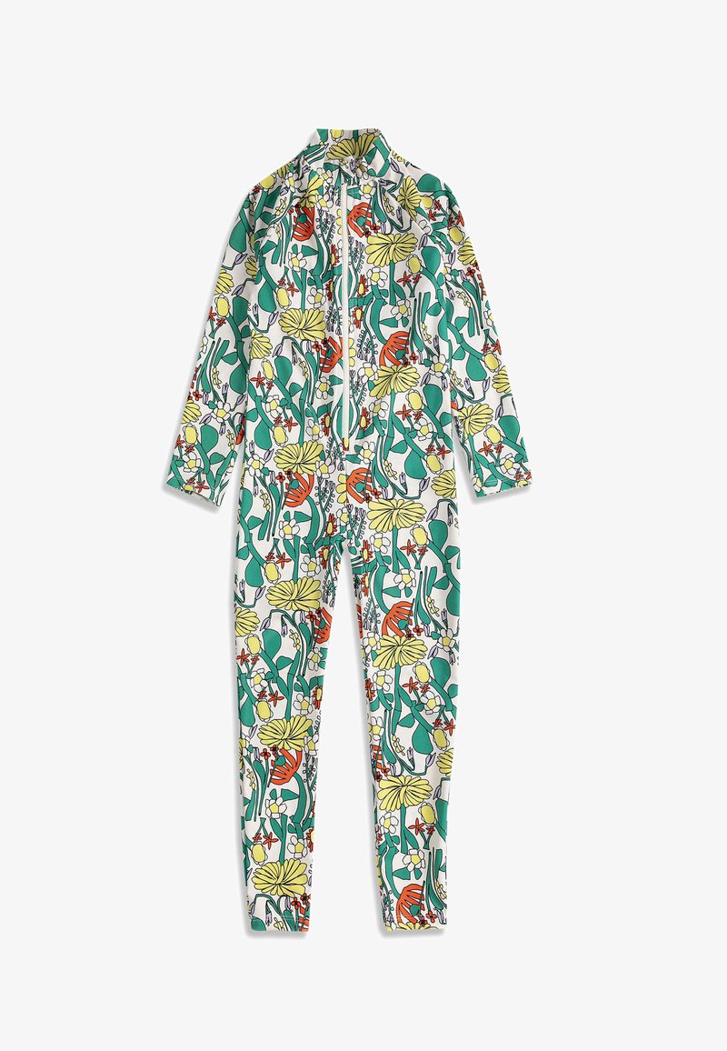 Combinaison à manches longues et longueur totale avec fermeture éclair à l'avant, présentant un motif floral coloré en vert, jaune, orange et rouge sur fond blanc.