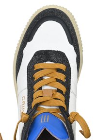 White sneaker with black and gold accents, textured surfaces, a blue tongue, and a lace-up design featuring golden laces and a rubber sole.