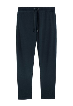 Pantalones jogger de color navy en una tela suave con cintura elástica y cordón. Presenta piernas ajustadas y sin patrones ni acentos de hardware.