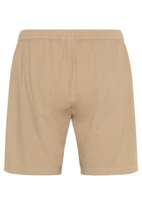 Beige cotton shorts with an elastic waistband. Simple design, no pockets or embellishments, featuring a relaxed fit and straight-cut hem.