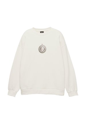 Biela dlhá mikina s dlhým rukávom, okrúhlym výstrihom a malou grafiku okrúhleho pendantu so psou tvárou v centre prednej časti.