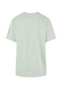 T-shirt vert clair à manches courtes en coton doux. Design simple avec col rond, texture lisse, sans motifs ni ornements.