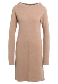 Beige långärmad stickad klänning med ribbat mönster och båthals, med en central söm som löper ner längs framsidan.