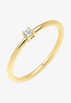 Guld ring med en poleret finish og en enkelt rund diamant indsat i en simpel fire-prongs indstilling. Stemplet med "375" for guld renhed.