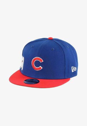 Blue baseball cap with a red brim, featuring white embroidery and a red "C" letter. Made from fabric with a structured design.