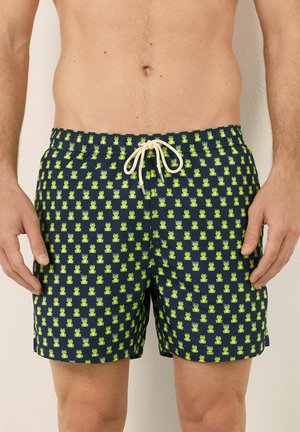 Marinefarbene Schwimmshorts mit einem Froschmuster in Grün und Hellblau, ausgestattet mit einem elastischen Bund und einem Kordelzug.