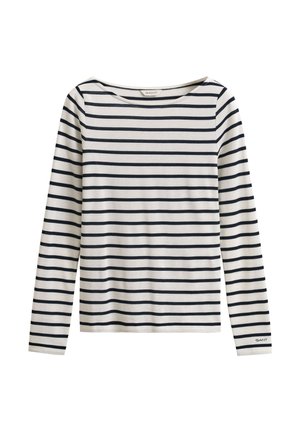 Fehér hosszú ujjú ing tengerészkék vízszintes csíkokkal és egy kis "GANT" logóval a bal ujjmandzsetta részen.