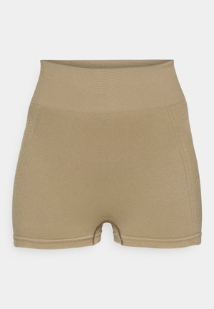 Shorts beiges taille haute en tissu extensible avec une texture lisse, présentant un design ajusté et des coutures minimales.