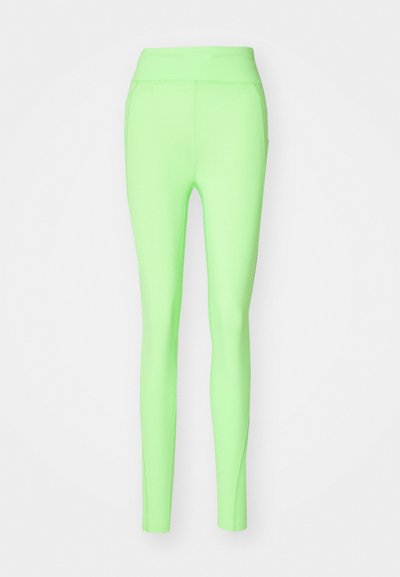Leggings vert néon avec une taille haute, design ajusté, texture lisse, sans motifs ni accents visibles.