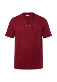 Bordeaux kortärmad t-shirt i bomull. Har en rund halsringning med snörningsdesign och metallöglor. Slät textur.