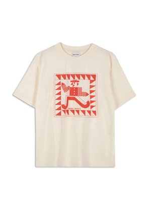 Cream short-sleeve t-shirt featuring a red graphic design with geometric shapes and a whimsical figure in the center. Soft cotton material.