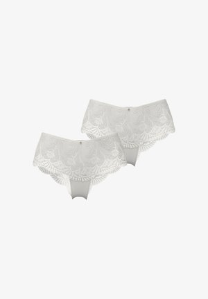 Ensemble de lingerie en dentelle blanche avec un design festonné, des motifs floraux et une doublure intérieure lisse. Comprend deux pièces avec des accents décoratifs.