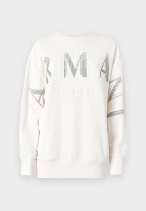 Cream-colored sweatshirt with green graphic text and lines. Features a round neck, long sleeves, and ribbed cuffs with a relaxed fit.