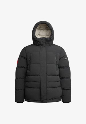 Mustaline puhvis jope kapuutsiga. Omab tõmbluku jaotustaskut rinnal, elastseid mansette ja tikitud disaini. Vooderdatud kontrastse beeži sisepinna vastu.