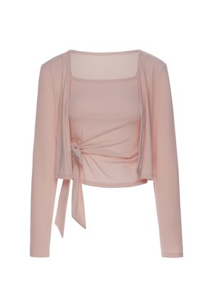 Top corto rosa chiaro a maniche lunghe con scollo quadrato e dettaglio annodato sul lato sinistro della vita.