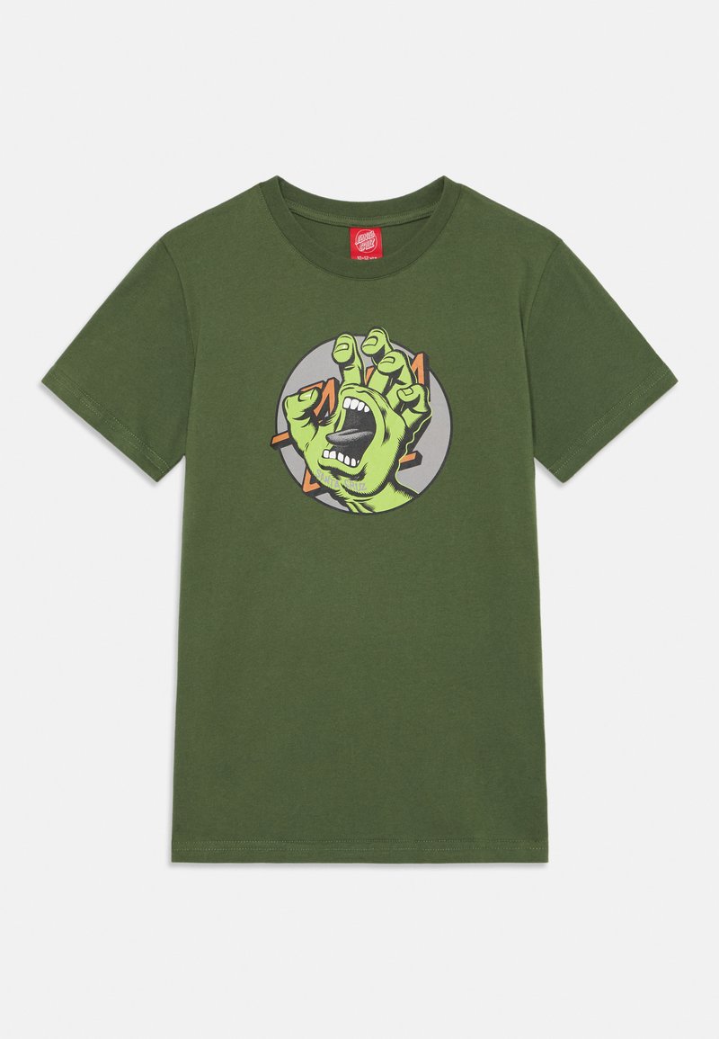 T-shirt de algodão verde com um gráfico de uma mão de zumbi verde com a boca aberta, sobre um fundo cinza circular.