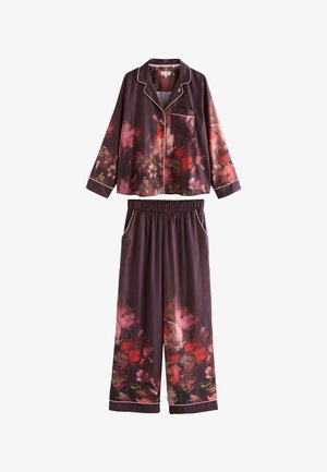 Langærmet pyjamasæt med knaplukket top og bukser med elastisk talje, mørkelilla med rødt og pink blomsterprint samt hvid pipingkant.
