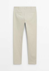 Beige trousers made of cotton. Features a straight leg, two back pockets, and a plain design with no visible patterns or accents.