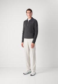 Lacoste Tepláky - hammam