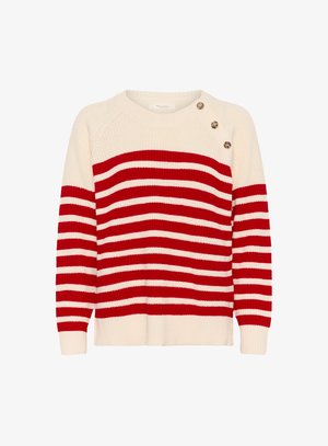 Pull en tricot avec un col rond, présentant des rayures horizontales alternées rouges et blanches, ainsi que trois boutons sur l'épaule gauche. Texture douce.