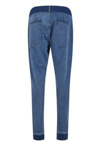 Blue denim joggers with a ribbed navy waistband, tapered legs, and two back pockets. Smooth texture with stitched detailing.