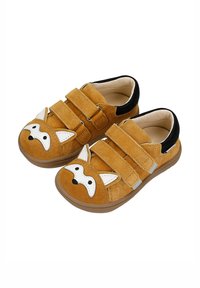Scarpe in camoscio tan con design di faccia di volpe, accenti bianchi per le orecchie e il naso, due cinturini in Velcro e fodera nera. Punta rotonda classica e suola flessibile.