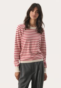 Gestreifter Pullover in Rot und Creme, aus weichem Material gefertigt. Verfügt über einen runden Halsausschnitt, lange Ärmel sowie gerippte Bündchen und Saum.