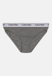 Szürke pamut bikini alsó, fehér derékkal, amelyen fekete "Calvin Klein" márkázás található. Puha tapintású és klasszikus fazonú.