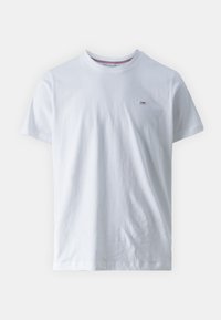 Vit bomullströja med rund hals, korta ärmar och en liten logotyp på vänster bröst. Slät textur och avslappnad passform.