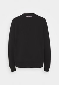 Sweat-shirt noir à manches longues avec poignets et bas côtelés, avec le texte « KARL LAGERFELD » en blanc au centre du haut du dos.