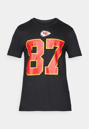 T-shirt nera con grande numero 87 rosso e giallo e logo dei Kansas City Chiefs sopra il numero sul davanti.