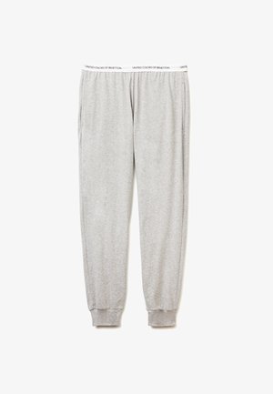 Pantalones de chándal grises hechos de una tela suave, presentan una cintura elástica con ribetes blancos de marca y puños acanalados en los tobillos.