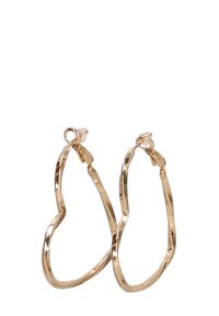 Pendientes de aro en tono dorado con un diseño ondulado e irregular. Fabricados en metal con un acabado brillante y cierre de seguridad.