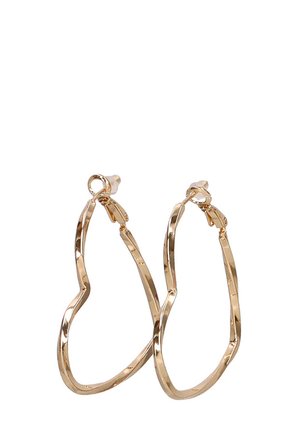 Pendientes de aro en tono dorado con un diseño ondulado e irregular. Fabricados en metal con un acabado brillante y cierre de seguridad.